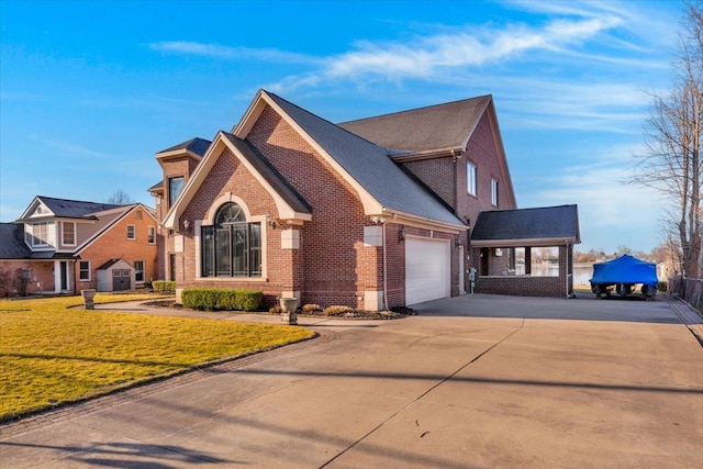 traditional-style house with concrete driveway, a garage, a front lawn, and brick siding