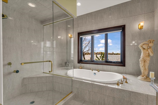 full bath with a stall shower, tile walls, tile patterned flooring, and a bath
