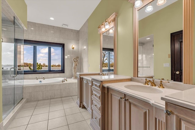 bathroom featuring vanity, visible vents, tile patterned floors, a stall shower, and a garden tub