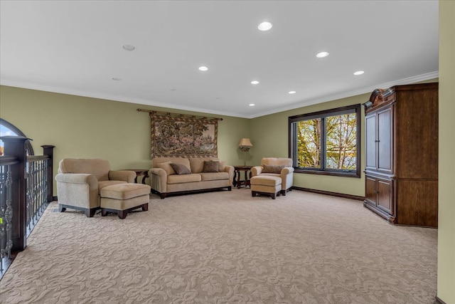 living area featuring crown molding, light carpet, baseboards, and recessed lighting