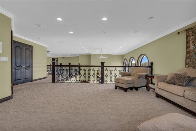 living area featuring ornamental molding, light carpet, recessed lighting, and baseboards