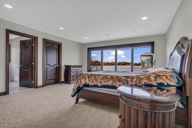 carpeted bedroom featuring baseboards and recessed lighting