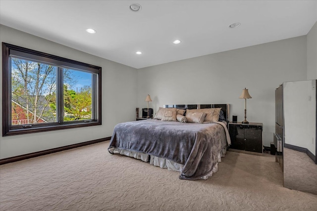 bedroom with baseboards, recessed lighting, and carpet floors