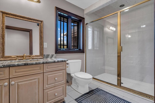 full bathroom with a shower stall, vanity, and toilet