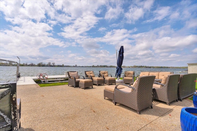 view of patio with a water view and an outdoor hangout area