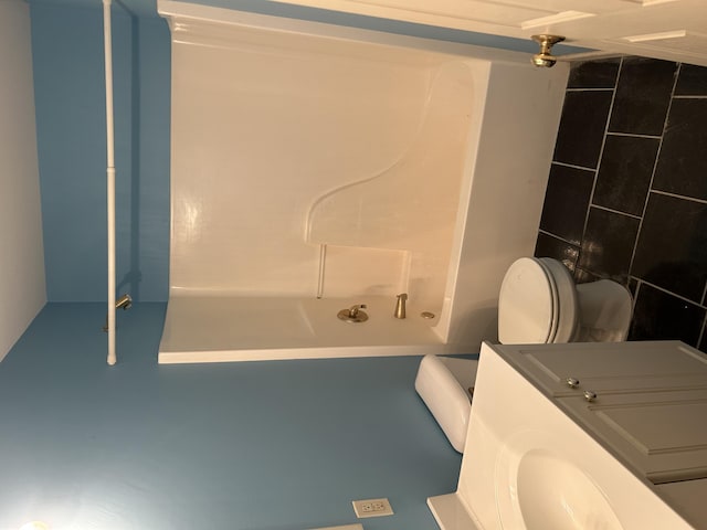 bathroom with a tub, toilet, and a shower