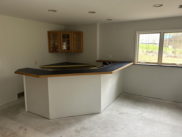 bar with recessed lighting, visible vents, and concrete floors