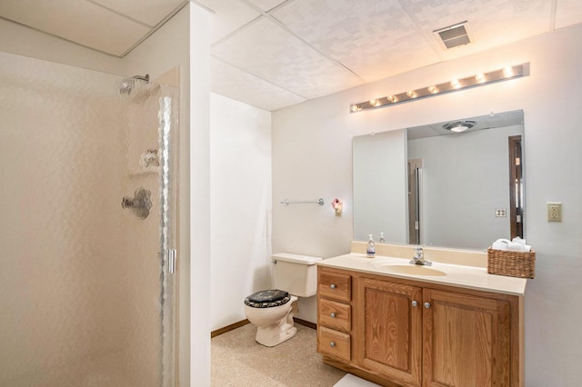 full bath with toilet, visible vents, baseboards, walk in shower, and vanity