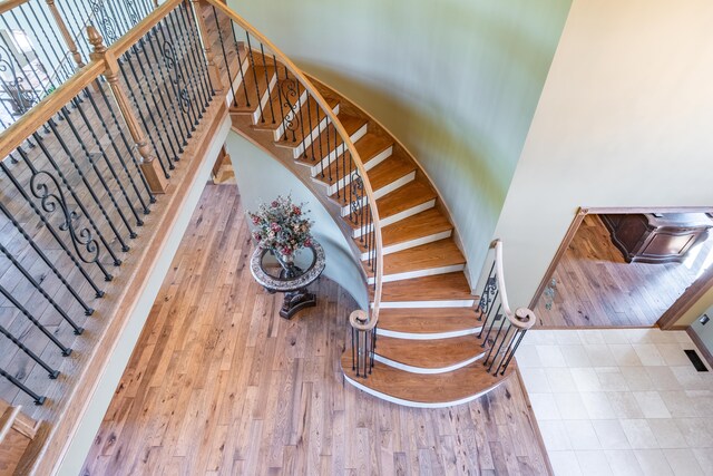 stairway with wood finished floors
