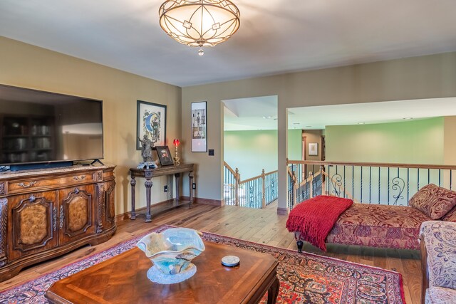 living room featuring hardwood / wood-style floors and baseboards