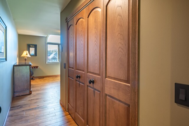 hallway with light wood-style floors
