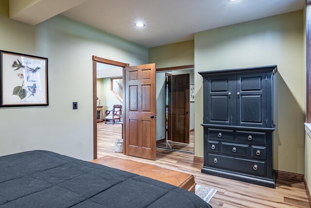 bedroom featuring light wood-style floors and recessed lighting