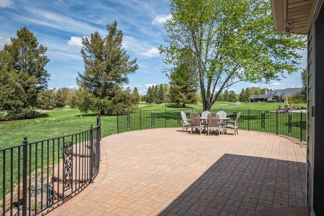 view of patio / terrace with outdoor dining area and golf course view