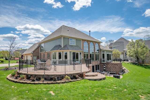 back of house with a patio and a sunroom