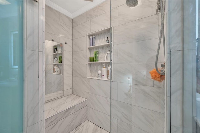bathroom with a stall shower and crown molding