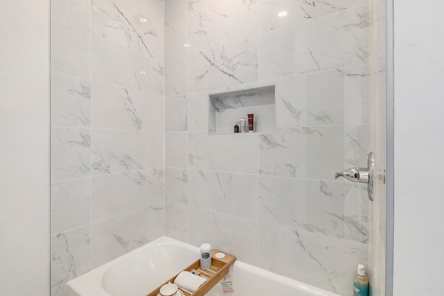 bathroom with a shower and a bathing tub