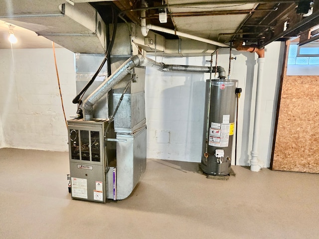 utility room with heating unit and gas water heater