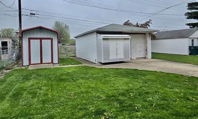 view of shed featuring fence