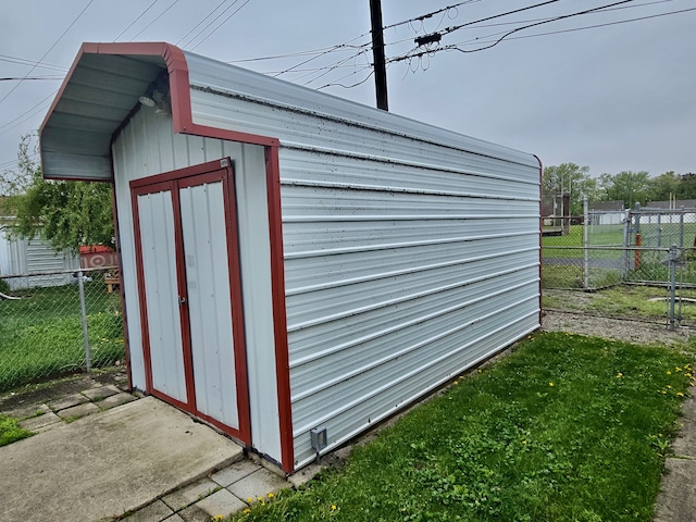 view of shed with fence