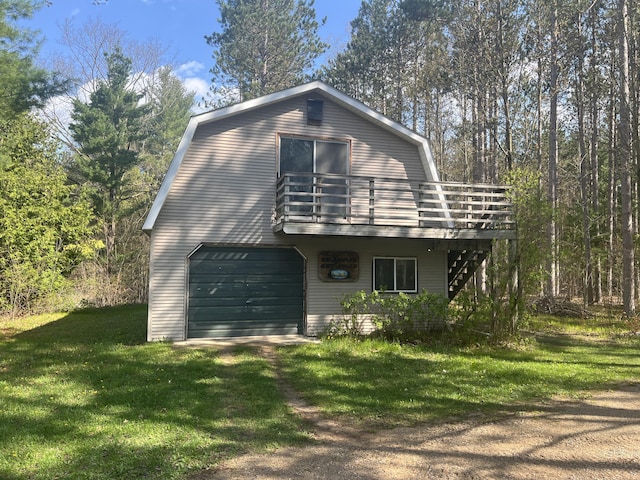 200 S Shearer Rd, Gladwin, MI 48624 - view of front of house with stairs, a deck, a gambrel roof, a garage, and a front lawn