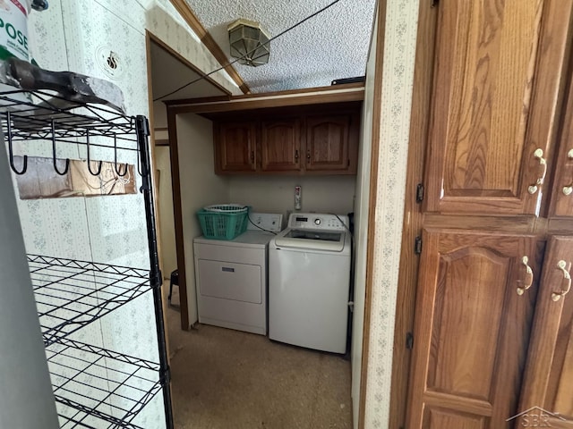 washroom with independent washer and dryer, cabinet space, light carpet, and wallpapered walls