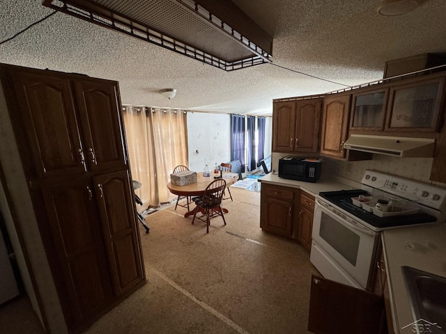 kitchen with a textured ceiling, white range, black microwave, extractor fan, and light countertops