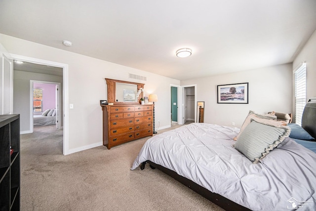 809 Sarah Ln, Milan, MI 48160 - bedroom featuring light carpet, baseboards, and visible vents