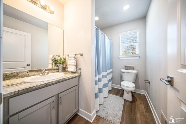 809 Sarah Ln, Milan, MI 48160 - full bathroom with toilet, wood finished floors, baseboards, vanity, and recessed lighting