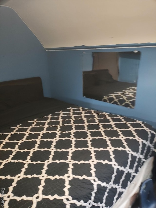 17121 Kelly Rd, Detroit, MI 48224 - bedroom featuring vaulted ceiling