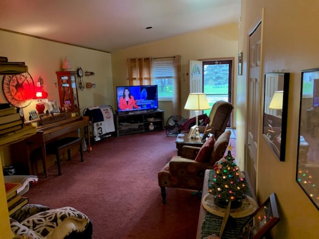 carpeted living room featuring vaulted ceiling