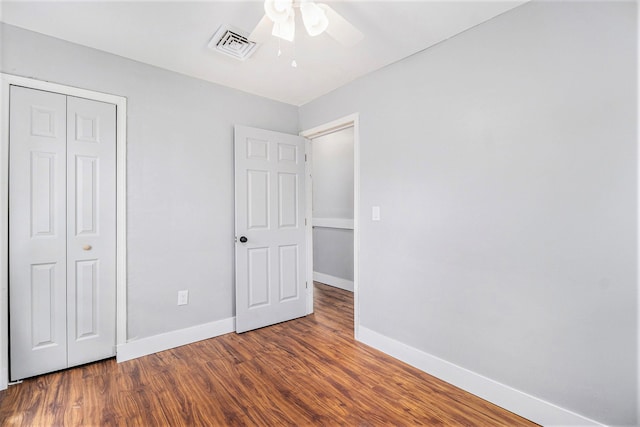 604 Montana Ave, Pontiac, MI 48341 - unfurnished bedroom with wood finished floors, baseboards, a closet, and ceiling fan