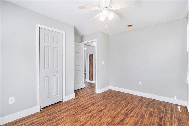 604 Montana Ave, Pontiac, MI 48341 - unfurnished bedroom featuring baseboards, wood finished floors, a closet, and ceiling fan