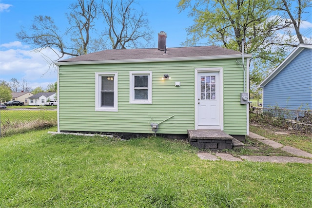 604 Montana Ave, Pontiac, MI 48341 - back of house with a chimney and a shingled roof