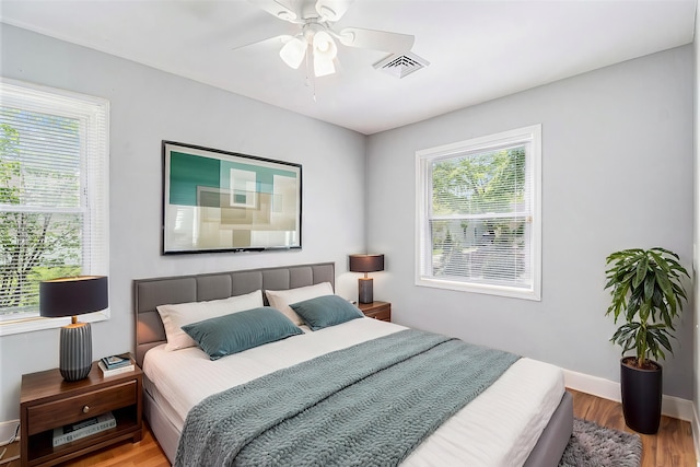 604 Montana Ave, Pontiac, MI 48341 - bedroom with wood finished floors, baseboards, and a ceiling fan