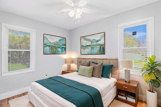 604 Montana Ave, Pontiac, MI 48341 - bedroom featuring baseboards, wood finished floors, and ceiling fan