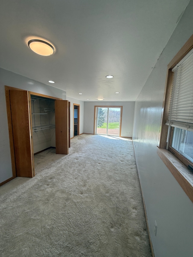 interior space featuring recessed lighting and carpet