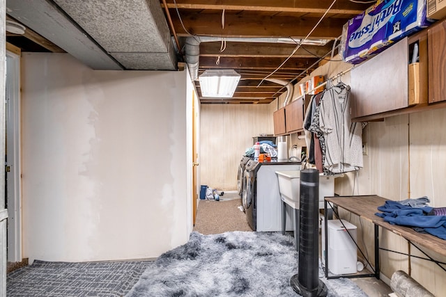 basement with washing machine and dryer and carpet flooring