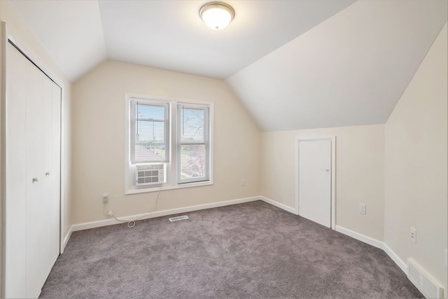bonus room with vaulted ceiling, carpet, baseboards, and cooling unit