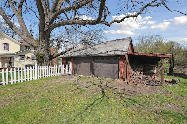 view of outbuilding with fence and an outdoor structure