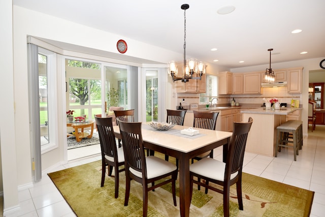 dining room with light tile patterned floors, a chandelier, and recessed lighting