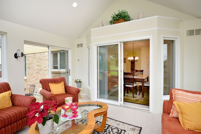 sunroom with visible vents and a notable chandelier