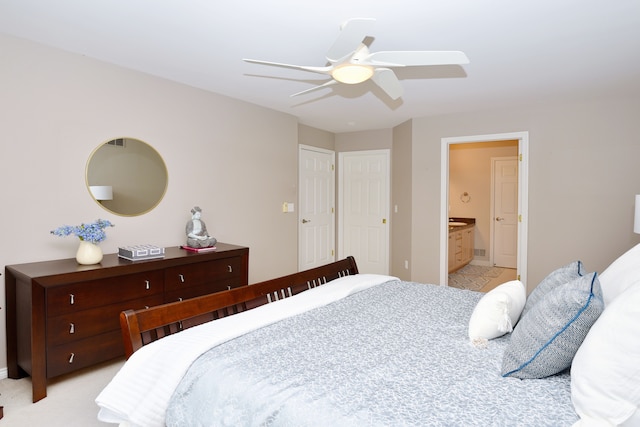 bedroom with ceiling fan and connected bathroom