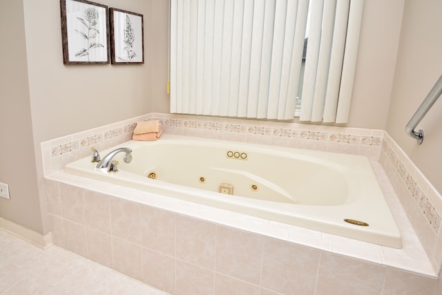 bathroom featuring a whirlpool tub and tile patterned flooring