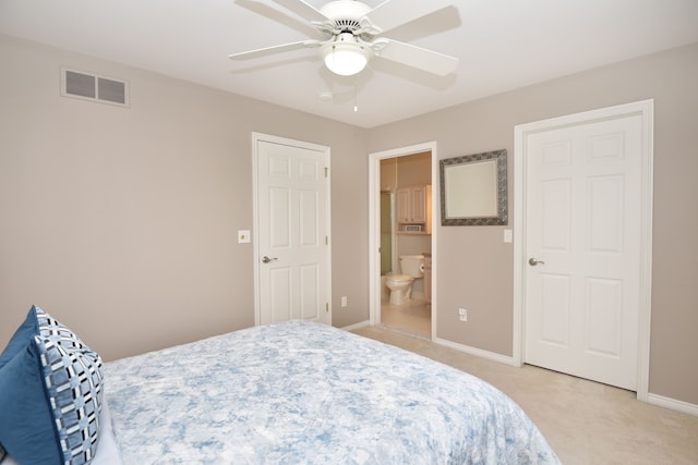bedroom featuring connected bathroom, a ceiling fan, visible vents, baseboards, and light colored carpet