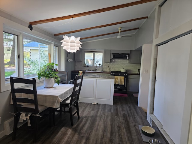 dining space with dark wood-style floors and ceiling fan