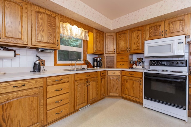 70765 Carter Ave, Niles, MI 49120 - kitchen featuring backsplash, range with electric stovetop, a sink, and white microwave