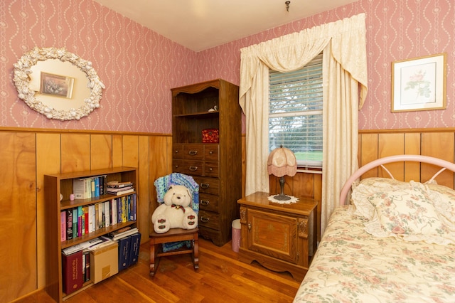 70765 Carter Ave, Niles, MI 49120 - bedroom with wallpapered walls, a wainscoted wall, and wood finished floors