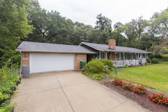 70765 Carter Ave, Niles, MI 49120 - ranch-style home featuring a porch, brick siding, concrete driveway, a garage, and a front lawn