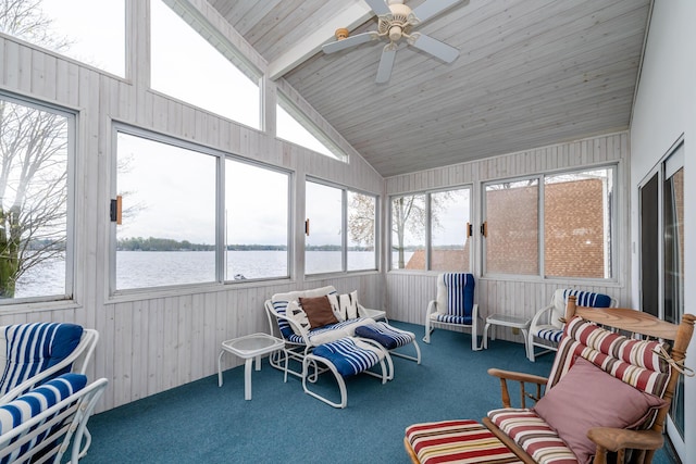 sunroom / solarium featuring a healthy amount of sunlight, a water view, and ceiling fan