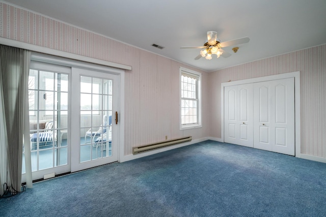 unfurnished bedroom with carpet flooring, access to exterior, wallpapered walls, a baseboard heating unit, and ornamental molding